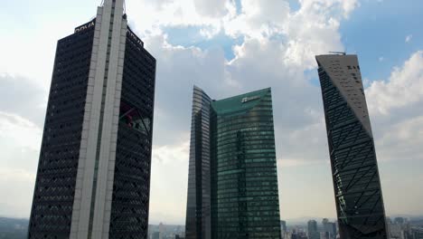 Low-angle-drone-aerial-view-of-modern-and-glassy-skyscrapers-in-south-Mexico-City