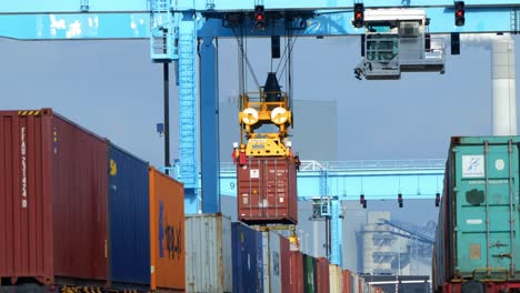 Shipping-Container-Being-Lifted-By-Giant-Gantry-Crane-At-APM-Maasvlakte-Terminal-In-Rotterdam