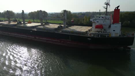 Aerial-Parallax-Across-Port-Side-Of-Sea-Prajna-Bulk-Carrier-As-It-Navigates-Along-Oude-Maas