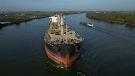 Aerial-Orbit-Around-Forward-Bow-Of-Sea-Prajna-Bulk-Carrier-As-It-Navigates-Along-Oude-Maas