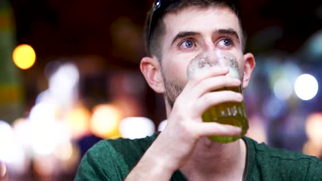 Young-Male-Traveller-Drinking-Bai-Hoi-At-Beer-Street-In-Hanoi-At-Night