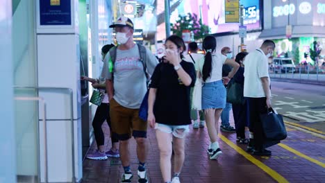 Atmosphere-people-on-the-sidewalk-of-night-on-one-of-the-Hongkong-streets