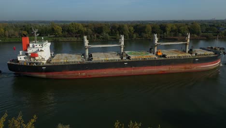 Aerial-Parallax-Across-Starboard-Side-Of-Sea-Prajna-Bulk-Carrier-As-It-Navigates-Along-Oude-Maas