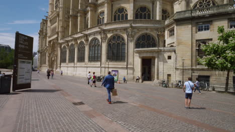 Walking-On-The-Street-In-The-Front-Of-Saint-Eustache-Catholic-Church-In-Paris,-France