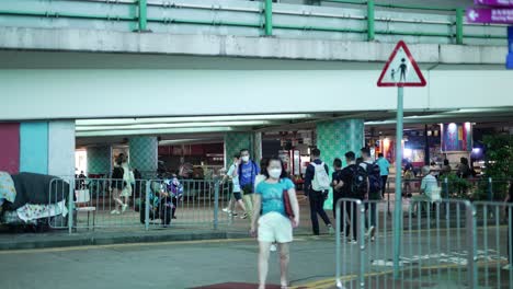 People-walking-across-the-street-in-Hong-Kong