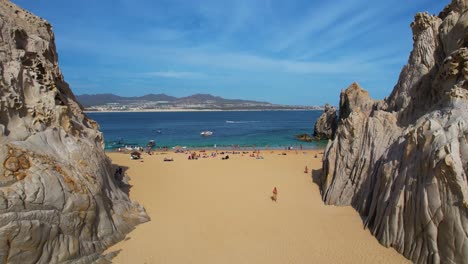 Aerial-view-over-people-on-the-Lovers-beach-in-sunny-Cabo-San-Lucas,-Mexico