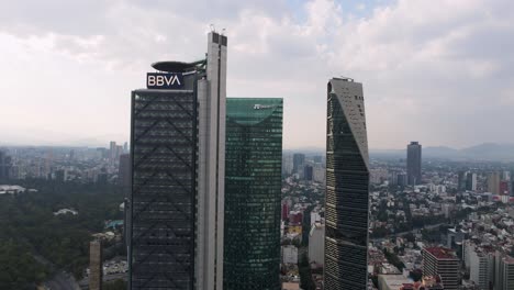 Aerial-dolly-out-revealing-huge-building-offices-standing-out-in-the-south-of-Mexico-City