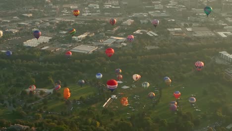 Blimps-rising-from-a-grassy-valley