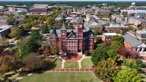 Clock-tower-on-university-campus,-Establishing-shot-of-brick-college-building