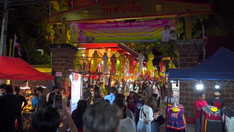 Many-people-enjoying-lanterns-for-Yi-Peng-festival-at-night-market-in-Thailand