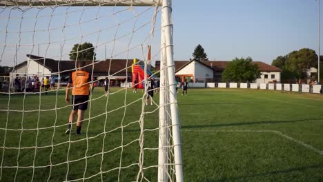 Football-tournament-match-in-Croatia,-city-of-Durdenovac,-Popular-sports,-Soccer,-played-by-amateurs-of-all-ages,-player-failed-to-score-a-goal