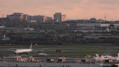 Emergency-Vehicle-Moving-on-International-Airport-Runway,-Tracking-Shot