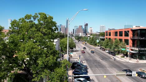 Aerial-drone-forward-moving-shot-flying-over-Austin-Motel-and-South-Congress-in-USA-on-a-sunny-day