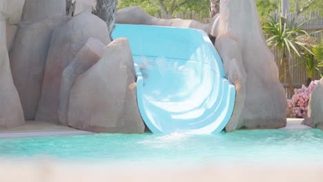 Mother-and-daughter-sliding-down-the-waterslide-in-the-aqua-park