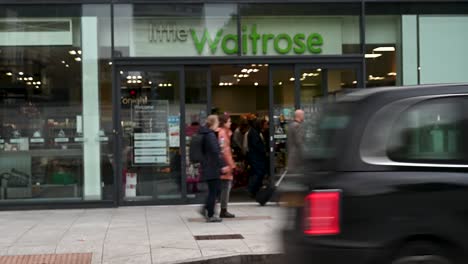 Entering-into-little-Waitrose,-London,-United-Kingdom