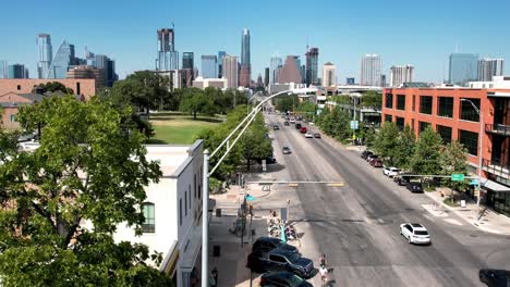 Austin,-Texas,-USA:-Aerial-drone-forward-moving-shot-over-Austin-Motel-and-South-Congress-on-a-bright-sunny-day