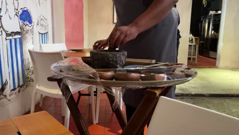 slow-motion-shot-of-cook-making-sauce-in-an-artisanal-way