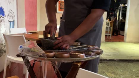 slow-motion-shot-of-cook-making-sauce-byartisanal-way-in-oaxaca