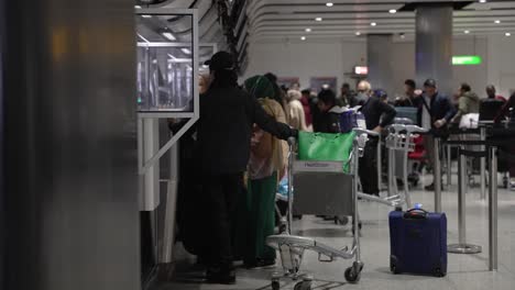 6-November-2022---View-Of-Passengers-Checking-For-Flight-At-Zone-G-At-Heathrow-Airport