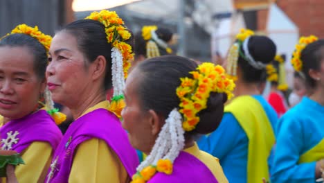 Elder-women-dressed-up-chatting-happily-during-Yi-Peng-Festival