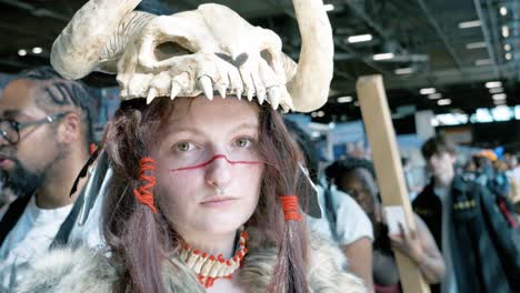 Woman-dressed-up-in-a-Neanderthal-costume-at-the-Japan-expo-in-Paris,-France-2022