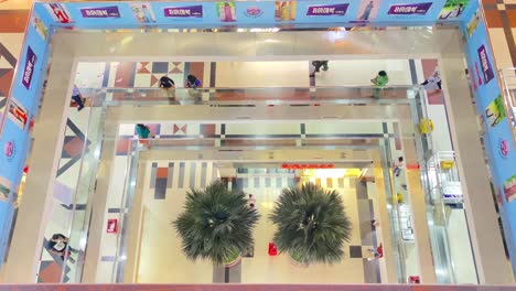 Looking-Down-At-Shopping-Mall-Floors-With-Shoppers-Walking-Past-In-Dhaka