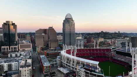 Aerial-view-in-front-the-Ball-Park-with-the-Great-American-tower-in-the-background,-sunrise-in-Cincinnati,-USA---tracking,-drone-shot