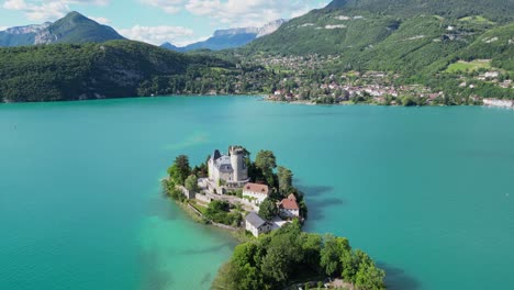 Chateau-Duingt-and-Turquoise-Light-Blue-Lake-Annecy-in-French-Alps---Aerial