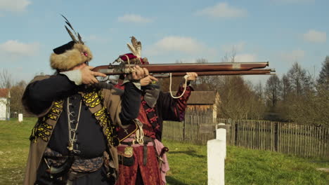 Two-medieval-soldiers-firing-muskets