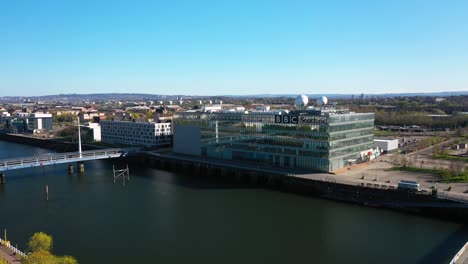 Aerial-shot-lifting-up-over-the-BBC-Building-in-Glasgow-next-to-the-River-Clyde