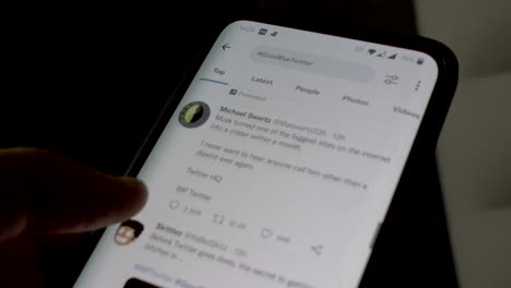 Finger-Scrolling-Through-Goodbye-Twitter-Hashtag-On-Mobile-Phone