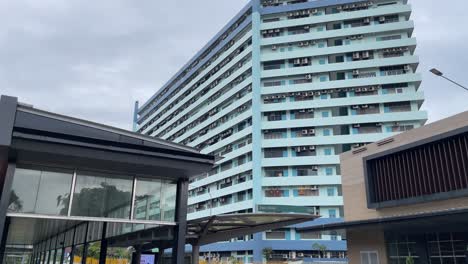 Tilt-up-view-of-Tan-Boon-Liat-Building-outside-the-exit-of-the-newest-Havelock-MRT-Station-in-Singapore,-Thomson-East-Coast-Line-stage-3