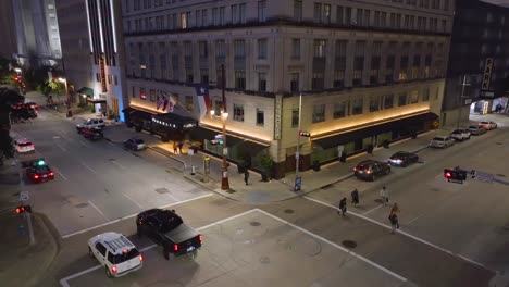 Aerial-view-of-traffic-and-people-on-the-Illuminated-streets-of-Houston,-USA