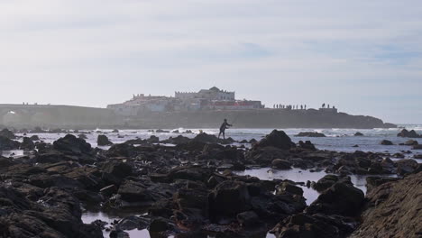 Silouette-of-a-man-fishing-in-front-of-Sidi-Abderrahman-island-in-Casablanca-Morocco