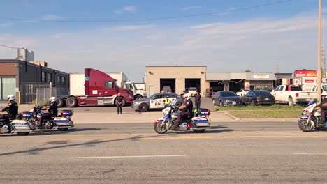 Officers-saluting-funeral-parade-of-another-officer