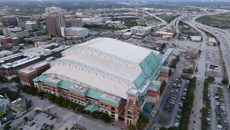 Aerial-view-around-the-Minute-maid-park,-cloudy-morning-in-Houston,-USA---orbit,-drone-shot