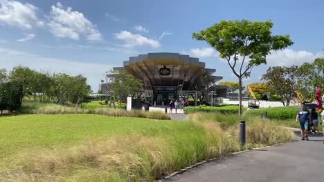 Tourists-exit-and-stroll-from-the-newest-Garden-By-the-Bays-MRT-Station-in-Singapore,-Thomson-East-Coast-Line-stage-3