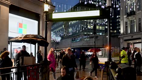 Rainy-day-down-to-the-Oxford-Street-Underground-next-to-the-Microsoft-Store,-London,-United-Kingdom