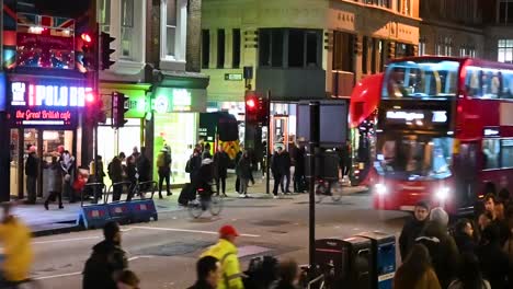 Buses-going-past-the-Great-British-Café-on-Liverpool-Street,-London,-United-Kingdom