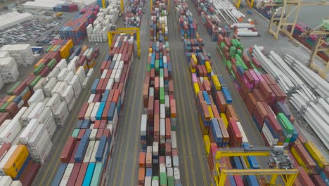 An-aerial-view-of-the-container-terminal-in-the-port-shows-rows-of-containers-with-goods-waiting-to-be-loaded-onto-ships