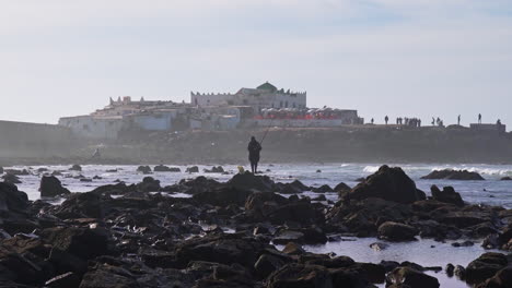 Fisherman-fishing-by-the-ocean-in-front-of-Sidi-Abderrahman-island-in-Casablanca-Morocco