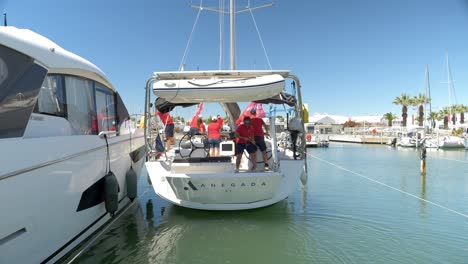 Slowmotion-rising-shot-of-a-sailor-lifting-up-the-back-of-the-boat