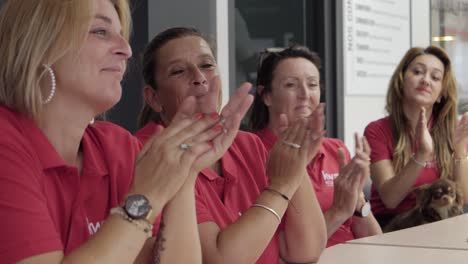 Women-clapping-their-hands,-applausing-after-a-speech