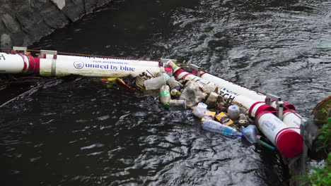 Zoom-out-revealing-ingenious-filter-structure-to-prevent-pollution-and-stop-all-debris-that-has-been-thrown-river