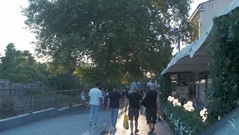 People-walking-along-Acropolis-neighbourhood-during-Sunset