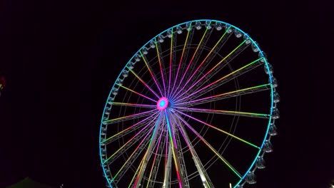 Low-angle-view-of-the-Ferris-wheel-in-front-of-a-castle