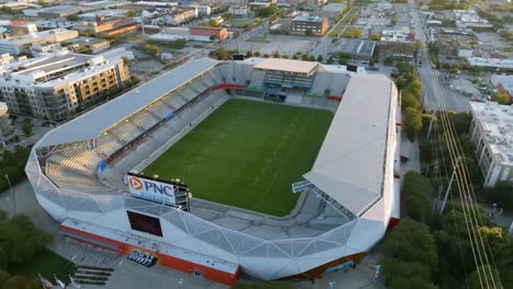 Flying-around-the-PNC-stadium,-golden-hour-in-Houston,-USA---Aerial-view