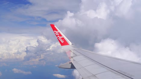 Beautiful-slow-motion-view-out-toward-Airplane-wing-flying-through-sky