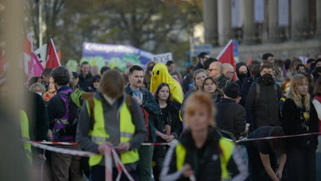 Slow-motion-shot-of-crowd-of-people-protesting-in-Berlin,-Germany,-handheld