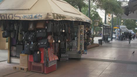 Kiosk-stall-selling-bags-on-the-pavement-in-downtown-Athens